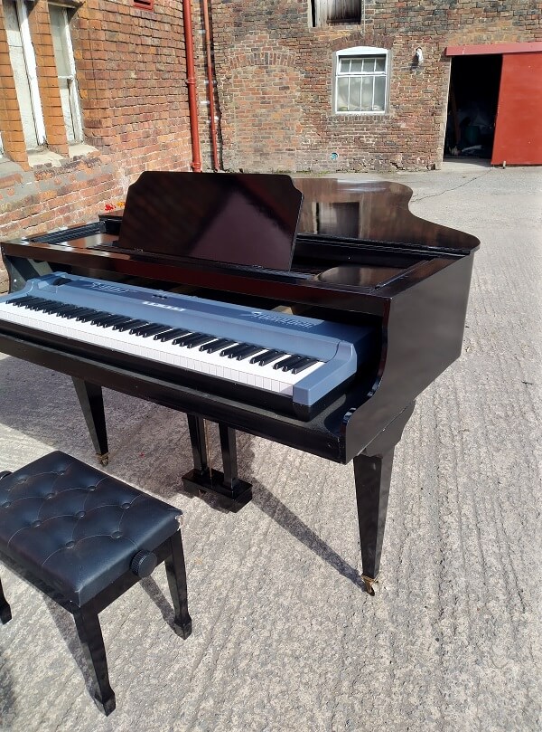 dummy baby grand piano with electric keyboard
